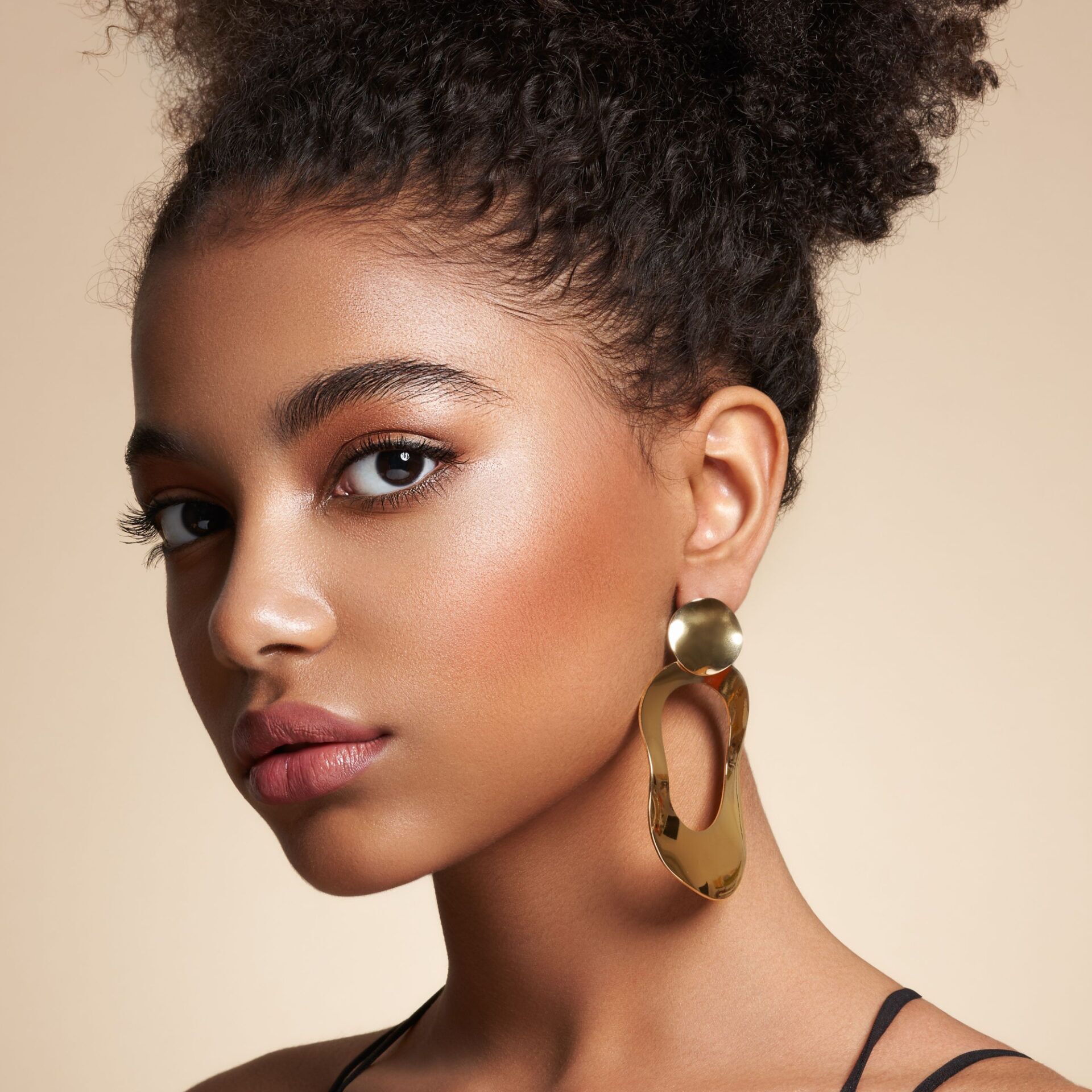 A sophisticated young woman glowing from her Dysport treatment from SkinEthics